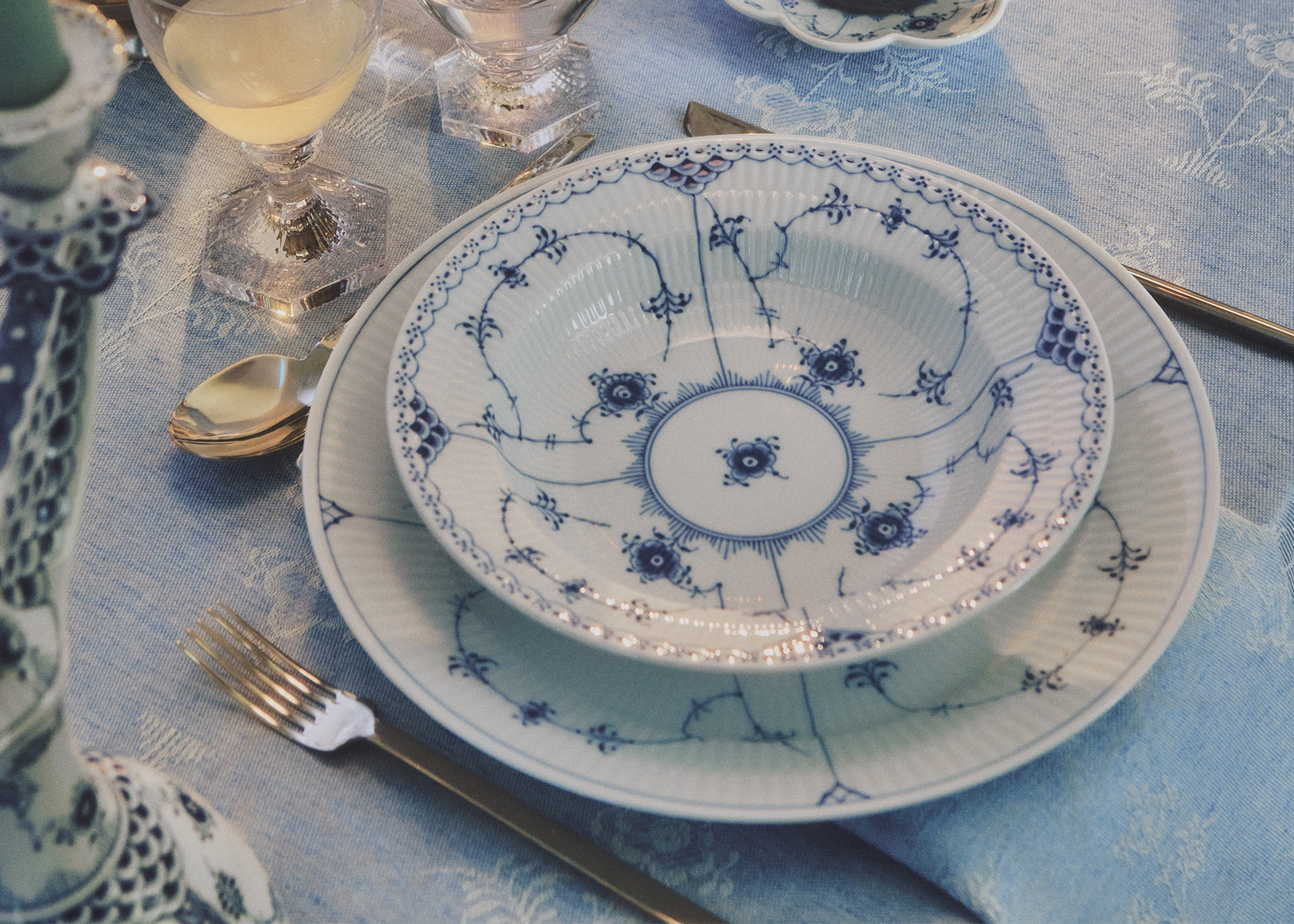 Blue Fluted Plain plates set with Aurora Wine and water glasses